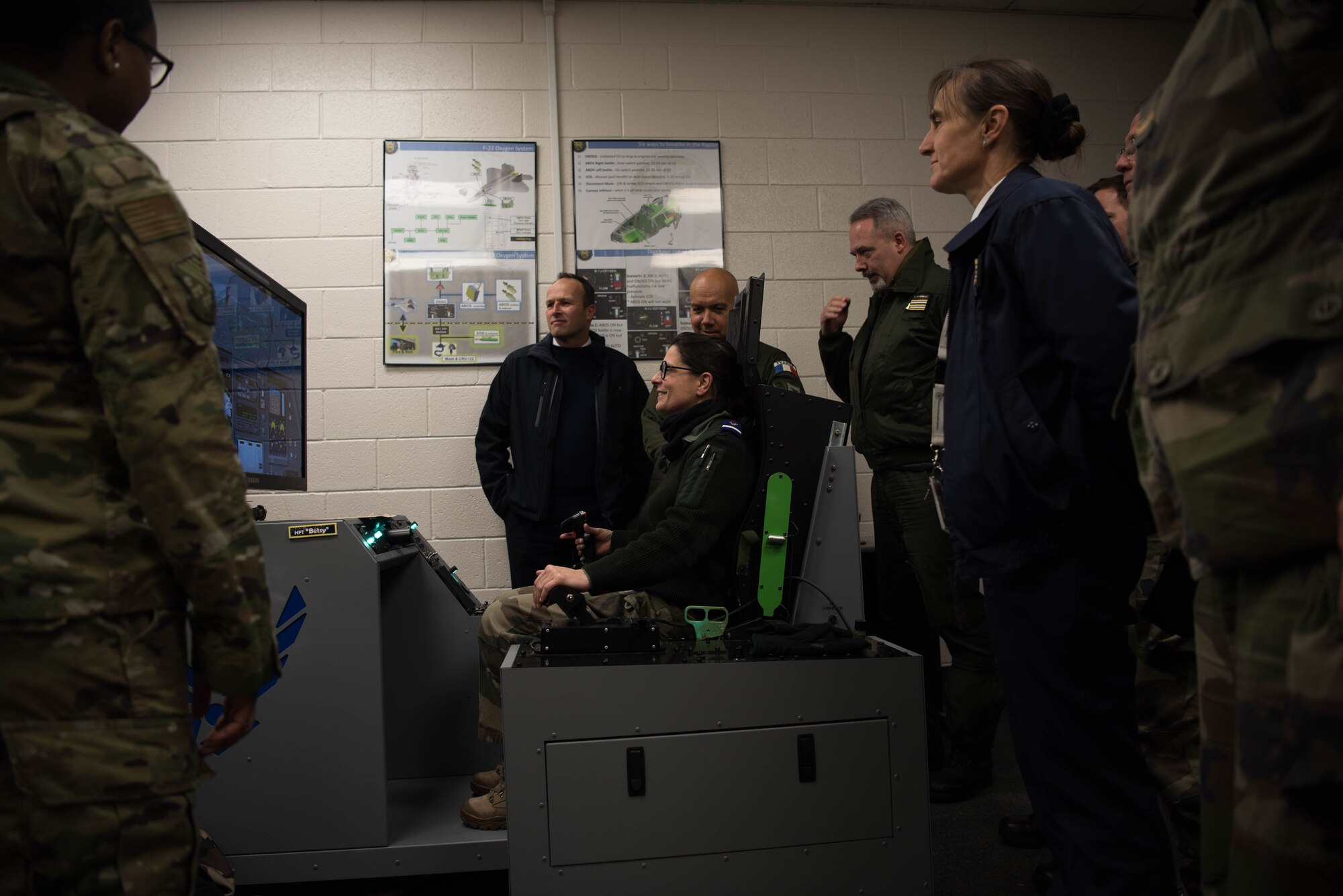 French delegates from the NATO – Allied Command Transformation operate a Reduced Oxygen Breathing Device (ROBD) during a visit to Joint Base Langley-Eustis, Virginia, Jan. 24, 2020. To help pilots learn how their body is feeling and reacting to lower levels of oxygen at high altitudes, the 1st Operations Group Aerospace and Operational Physiology team uses the ROBD, which is designed to induce hypoxia symptoms in a training environment. (U.S. Air Force photo by Airman 1st Class Marcus M. Bullock)