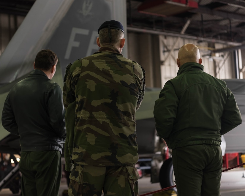 French delegates from the NATO – Allied Command Transformation view a U.S. Air Force F-22 Raptor during a visit to Joint Base Langley-Eustis, Virginia, Jan. 24, 2020. During their visit, French delegates were able to walk around the F-22 and learn about the 1st Fighter Wing’s rich history. (U.S. Air Force photo by Airman 1st Class Marcus M. Bullock)
