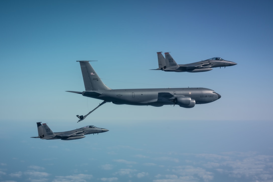Jet refuels from tanker.