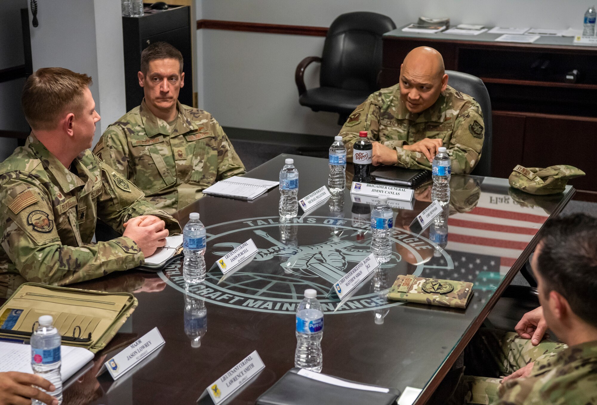 Brig. Gen. Jimmy Canlas, 618th Air Operations Center commander, speaks to mission generators Jan. 24, 2020, at Dover Air Force Base, Del. Canlas had an open discussion with leaders from the aircraft maintenance squadron, aerial port squadron, maintenance squadron, communication squadron and logistics readiness squadron. (U.S. Air Force photo by Senior Airman Christopher Quail)