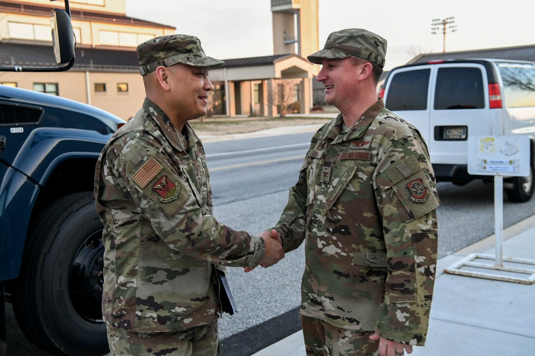 Col. Matthew Jones, 436th Airlift Wing commander, greets Brig. Gen. Jimmy Canlas, 618th Air Operations Center (AOC) commander, Jan. 24, 2020, at Dover Air Force Base, Del. Canlas, along with other members of the 618th AOC toured various units on Dover AFB. (U.S. Air Force photo by Senior Airman Christopher Quail)