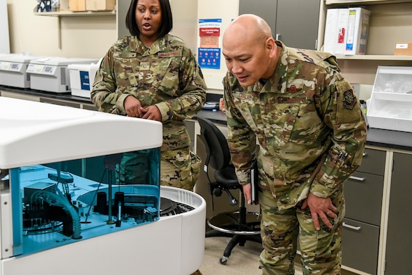 Brig. Gen. Jimmy Canlas, 618th Air Operations Center commander, views Armed Forces Medical Examiner System (AFMES) forensic equipment Jan. 24, 2020, at Dover Air Force Base, Del. Canlas visited AFMES to learn more about their forensic investigative services, to include forensic pathology, DNA forensics, forensic toxicology and medical mortality surveillance. (U.S. Air Force photo by Senior Airman Christopher Quail)