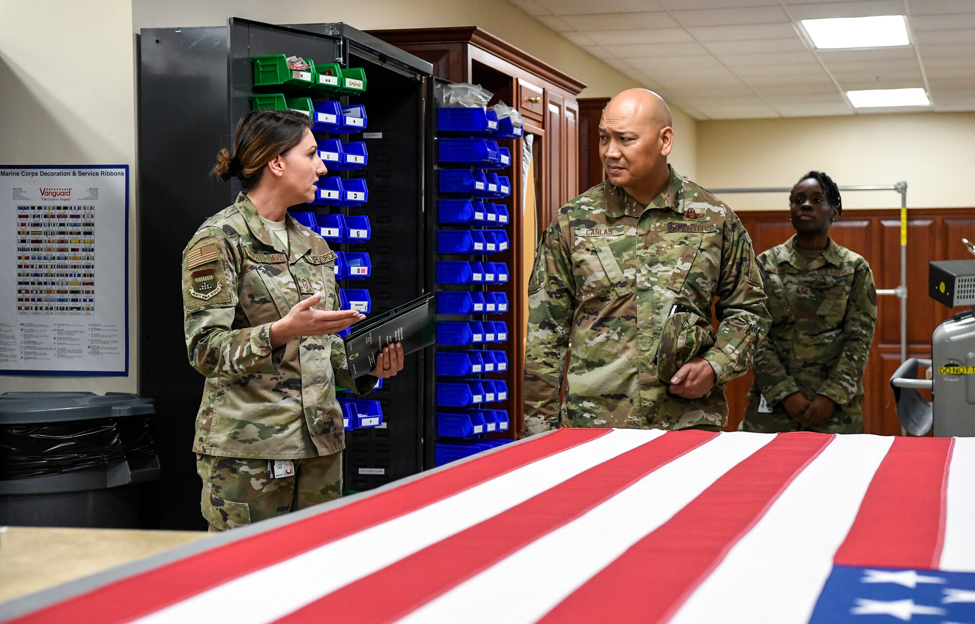 Master Sgt. Holly Roberts-Davis, Air Force Mortuary Affairs Operations public affairs, speaks to Brig. Gen. Jimmy Canlas, 618th Air Operations Center commander, Jan. 24, 2020, at Dover Air Force Base, Del. Roberts-Davis briefed Canlas on how AFMAO provides care, service and support to fallen service members and their families. (U.S. Air Force photo by Senior Airman Christopher Quail)