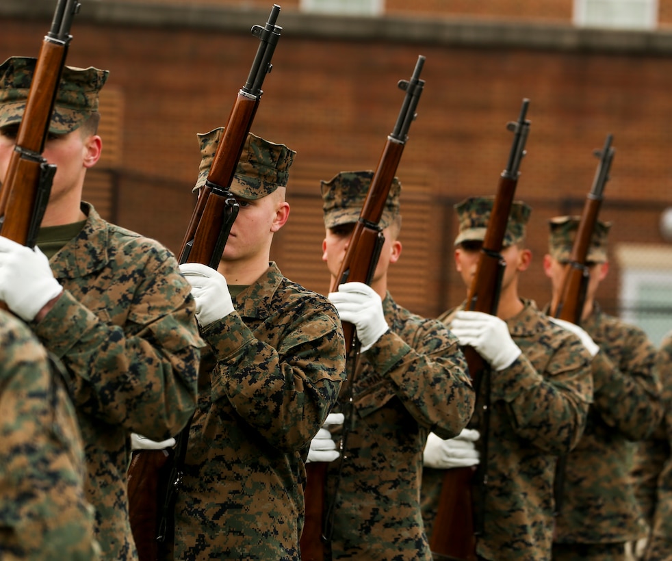 Marines with Alpha Company, Marine Barracks Washington, hone their precision drill during a firing party practice at Marine Barracks Washington, D.C., Jan. 23, 2020. The Marines rehearse the sequence every week in preparation for upcoming funerals at Arlington National Cemetery. (U.S. Marine Corps photo by Lance Cpl. Allen Sanders)