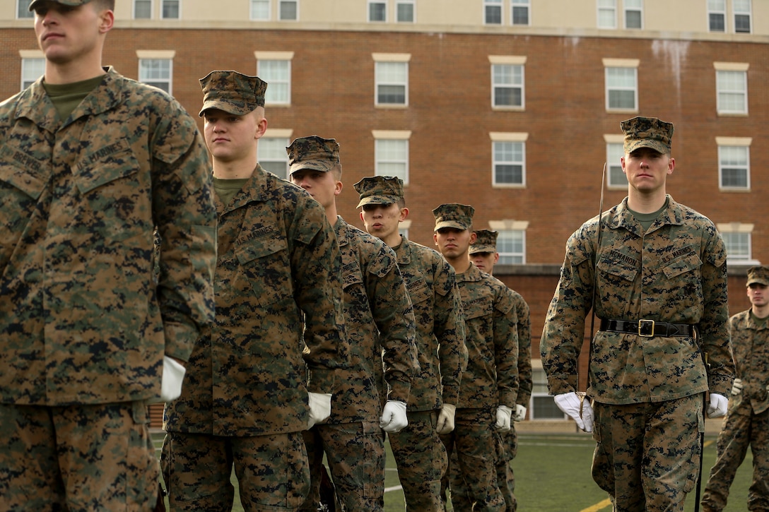Marines with Alpha Company, Marine Barracks Washington, hone their precision drill during a firing party practice at Marine Barracks Washington, D.C., Jan. 23, 2020. The Marines rehearse the sequence every week in preparation for upcoming funerals at Arlington National Cemetery. (U.S. Marine Corps photo by Lance Cpl. Allen Sanders)