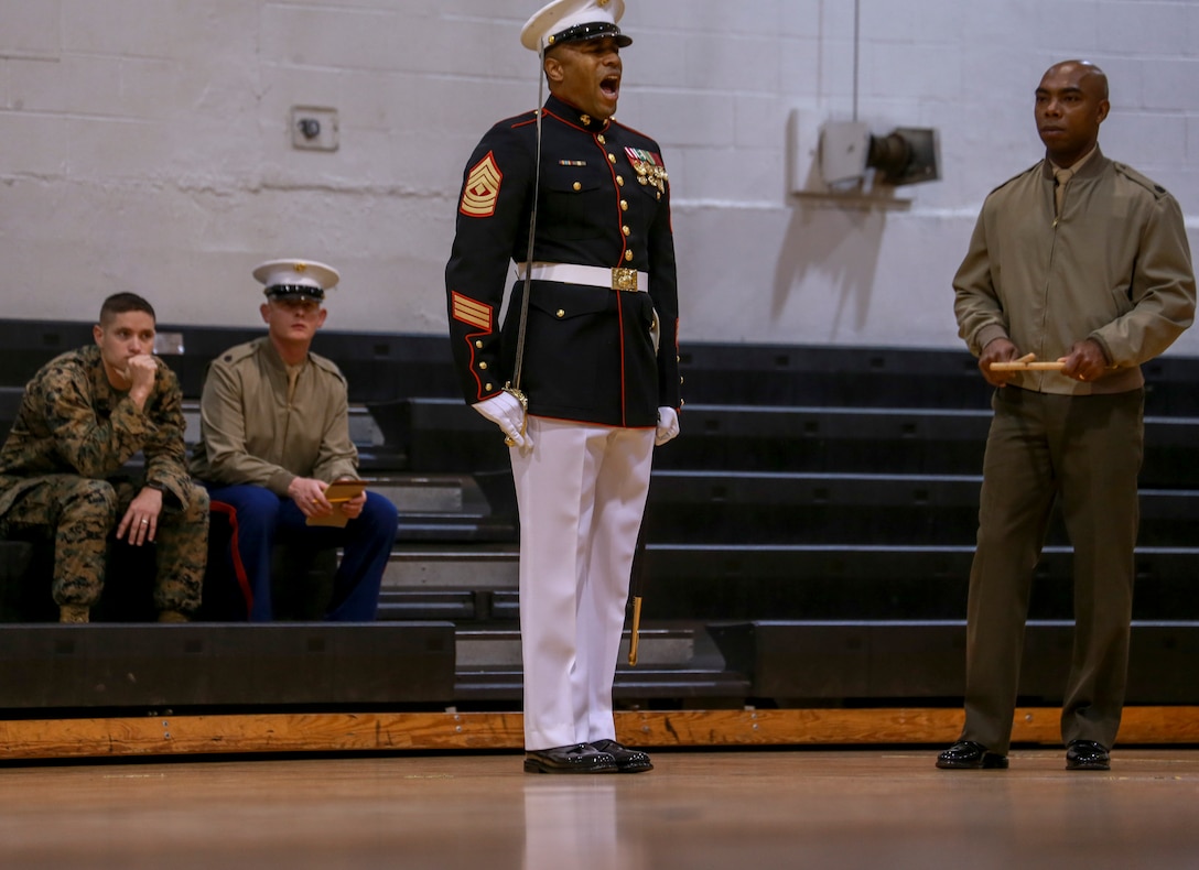 First Sgt. Christopher Johnson, company first sergeant, Bravo Company, Marine Barracks Washington, calls a commands during Ceremonial Drill School (CDS) evaluations at Marine Barracks Washington, D.C., Jan. 28, 2020. The three-week CDS course teaches Marines the fundamentals of ceremonial drill that is unique to the “Oldest Post of the Corps.” (U.S. Marine Corps photo by Lance Cpl. Allen Sanders)