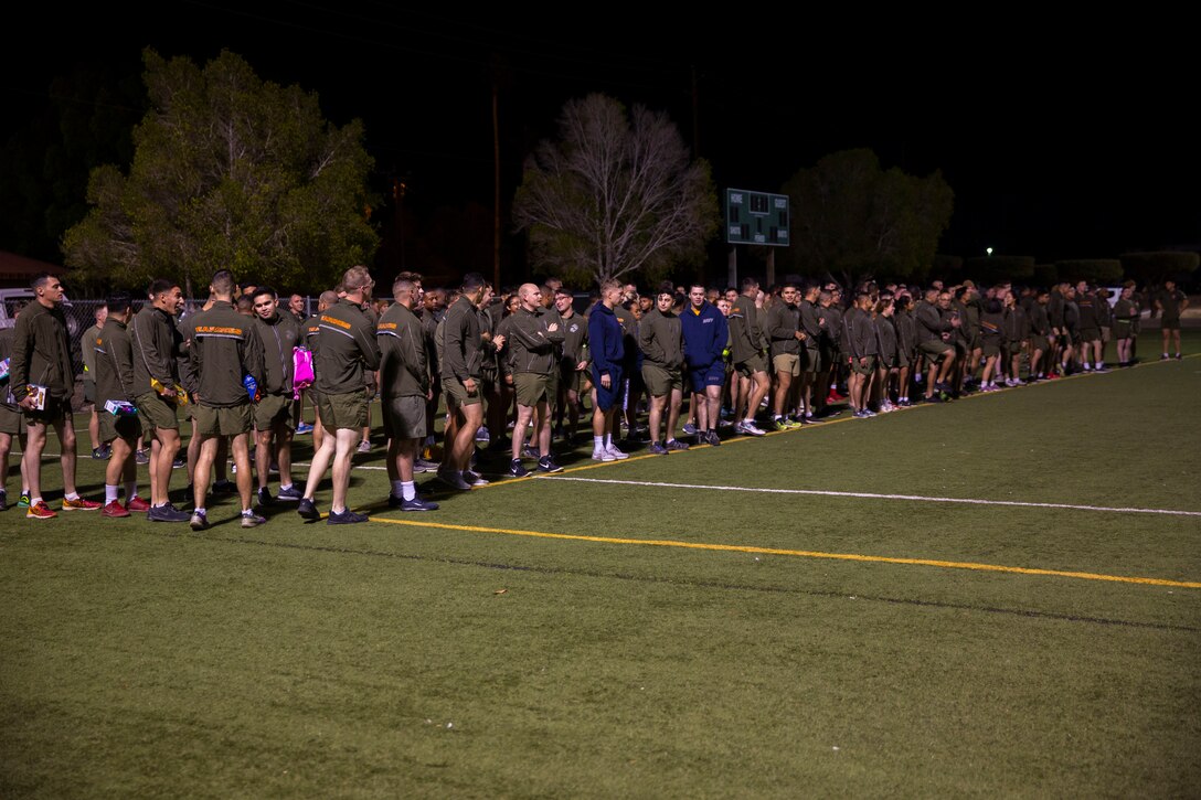 Marines and Sailors with Headquarters and Headquarters Squadron (H&HS) participate in a squadron run on Marine Corps Air Station (MCAS) Yuma, Ariz., Dec. 13, 2019. During the run, Marines and Sailors donated gifts to the Toys For Tots foundation (U.S. Marine Corps photo by Lance Cpl. Andres Hernandez)