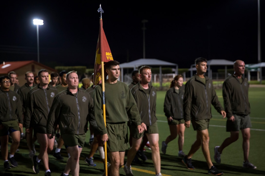 Marines and Sailors with Headquarters and Headquarters Squadron (H&HS) participate in a squadron run on Marine Corps Air Station (MCAS) Yuma, Ariz., Dec. 13, 2019. During the run, Marines and Sailors donated gifts to the Toys For Tots foundation (U.S. Marine Corps photo by Lance Cpl. Andres Hernandez)