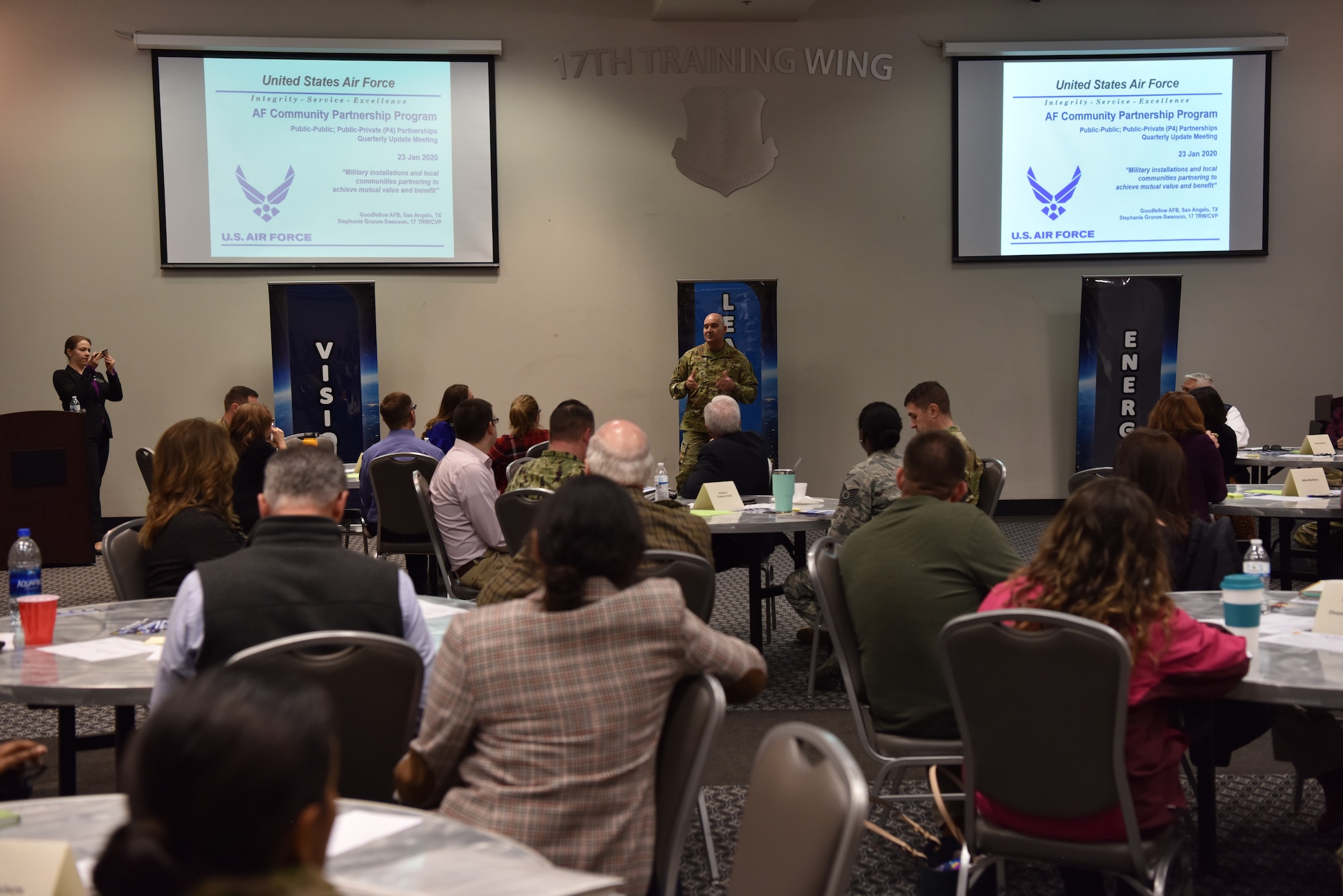 U.S. Air Force Col. Robert Ramirez, 17th Training Wing vice commander, speaks during the quarterly update meeting while hosting the Air Force Community Partnership Civic Partner Base Tour at the event center on Goodfellow Air Force Base, Texas, Jan. 23, 2020. The quarterly update meeting hosted over 80 total military and civic attendees. (U.S. Air Force photo by Staff Sgt. Chad Warren)