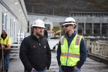 Bill talking to co-worker.