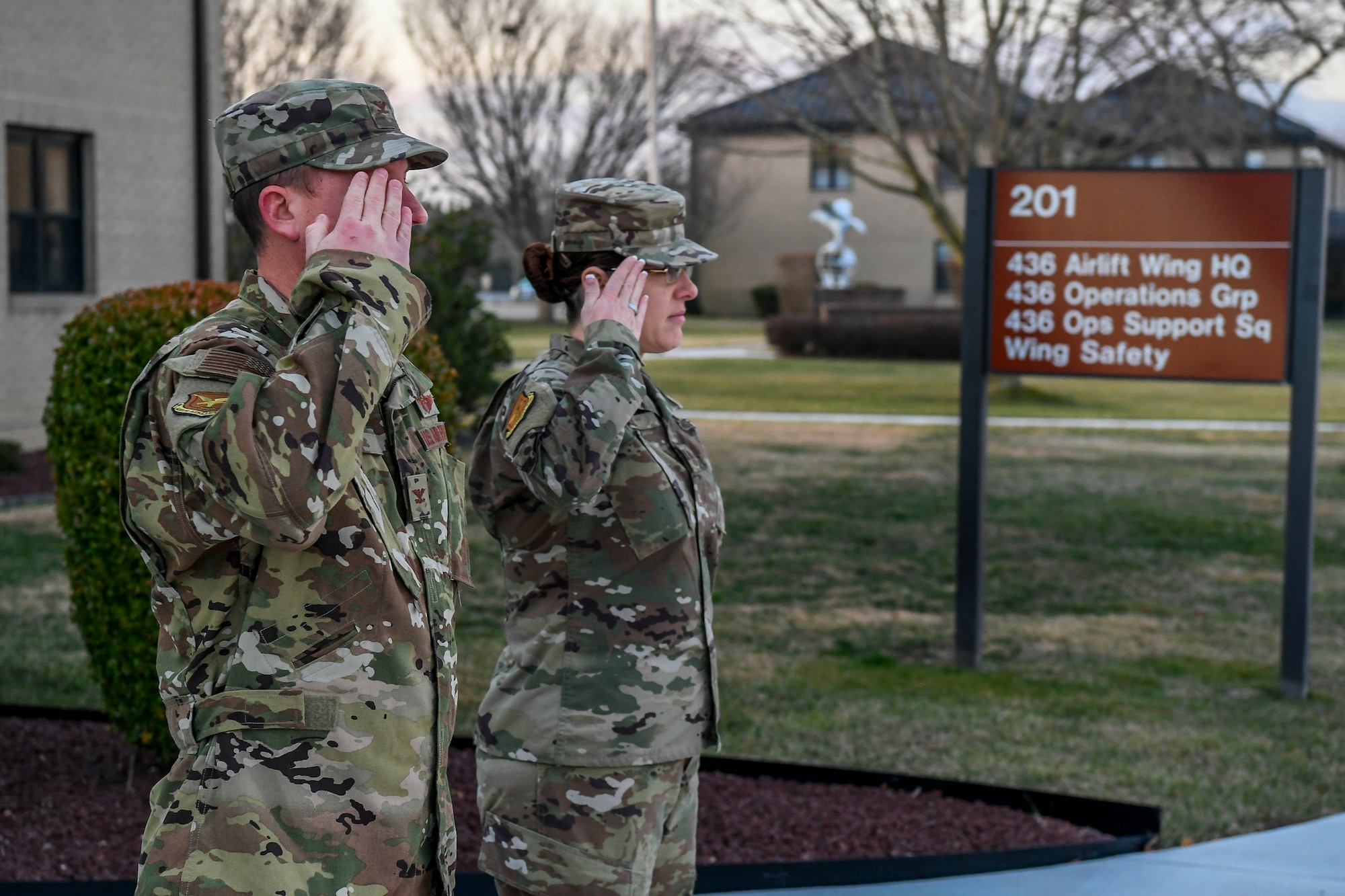 Col. Matthew Jones, 436th Airlift Wing (AW) commander, and Chief Master Sgt. Shae Gee, 436th AW command chief, salute a distinguished visitor surrey Jan. 24, 2020, at Dover Air Force Base, Del. Leadership from the 618th Air Operations Center toured various base units to gain a better understanding of Dover AFB’s mission. (U.S. Air Force photo by Senior Airman Christopher Quail)
