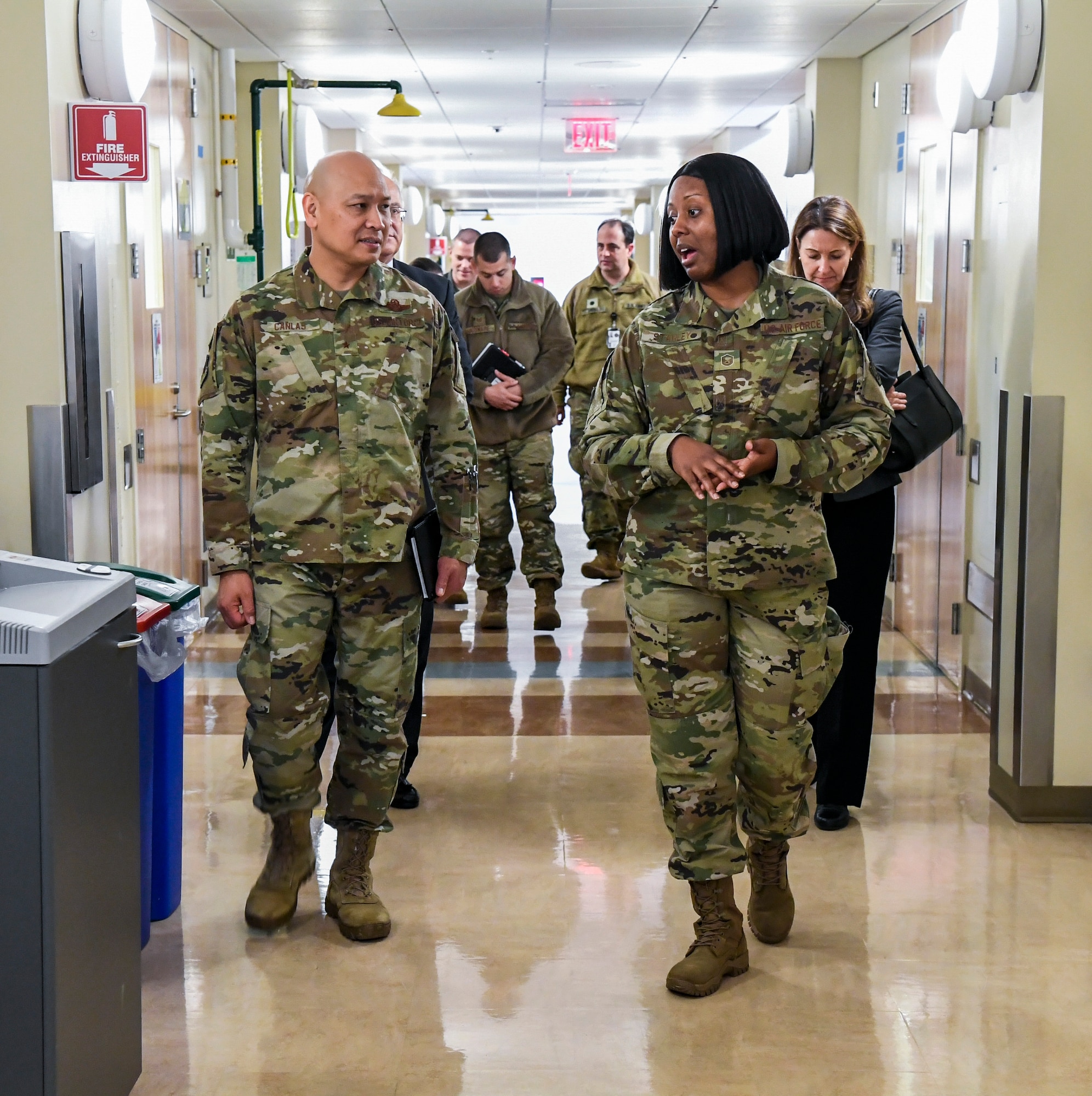 Master Sgt. Iesha Stanley (right), Armed Forces Medical Examiner System (AFMES) flight chief of forensic toxicology, speaks to Brig. Gen. Jimmy Canlas, 618th Air Operations Center commander, Jan. 24, 2020, at Dover Air Force Base, Del. Canlas visited AFMES to learn more about their forensic investigative services, to include forensic pathology, DNA forensics, forensic toxicology and medical mortality surveillance. (U.S. Air Force photo by Senior Airman Christopher Quail)