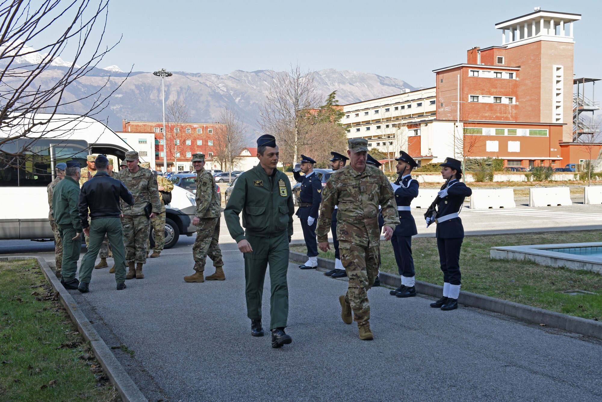 U.S. Air Force Maj. Gen. John Gordy, U.S. Air Force Expeditionary Center commander, right, meets with Italian air force Col. Luca Crovatti, Aviano Air Base commander, left, during a site visit of the 724th Air Mobility Squadron at Aviano Air Base, Italy, Jan. 24, 2020. The USAF Expeditionary Center provides direct oversight for the Global Air Mobility Support System and installation support, contingency response and building partnership capacity mission sets within the global mobility enterprise.