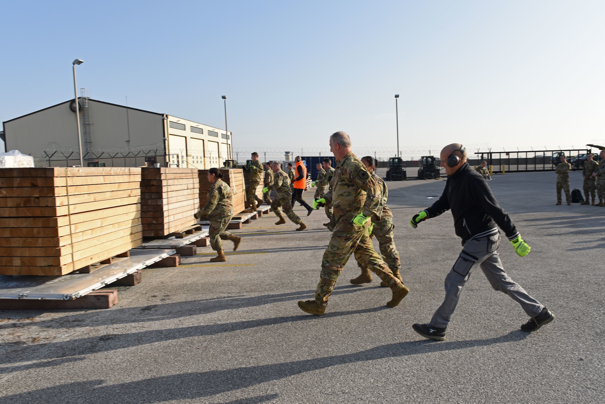 U.S. Air Force Expeditionary Center leadership participates in a pallet building competition with Airmen from the 724th Air Mobility Squadron and the 31st Logistics Readiness Squadron at Aviano Air Base, Italy, Jan. 24, 2020. The competition was part of a site visit conducted by the USAF Expeditionary Center as part of a larger visit to the geographically separated units under the 521st Air Mobility Operations Wing’s area of responsibility.