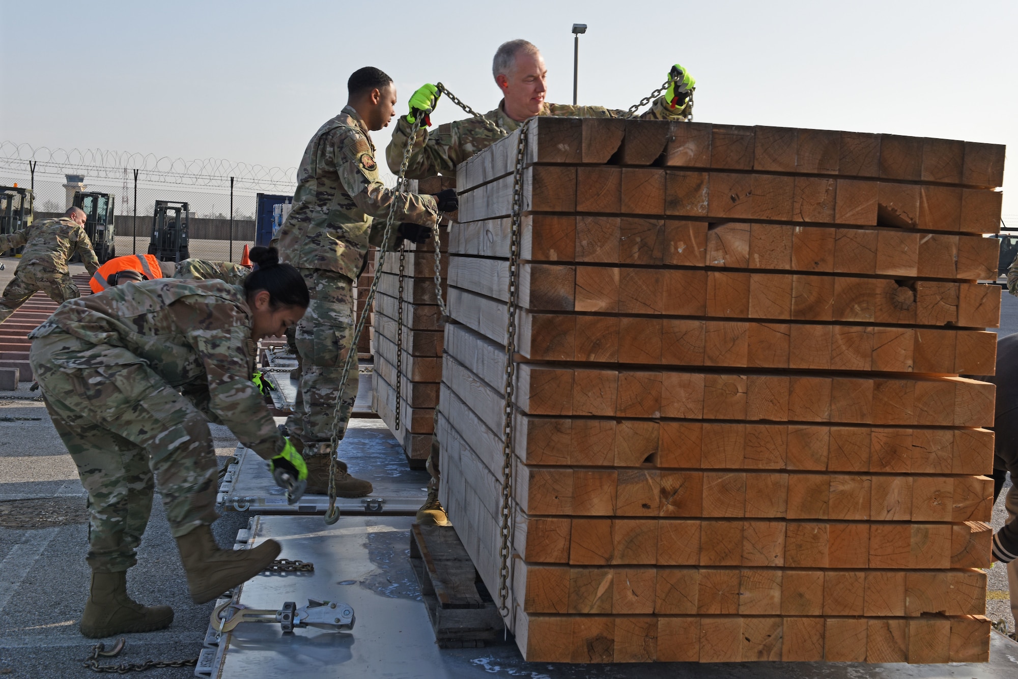 U.S. Air Force Maj. Gen. John Gordy, U.S. Air Force Expeditionary Center commander, assists his team during a pallet building competition with Airmen from the 724th Air Mobility Squadron and the 31st Logistics Readiness Squadron at Aviano Air Base, Italy, Jan. 24, 2020. The competition was part of a site visit conducted by the USAF Expeditionary Center as part of a larger visit to the geographically separated units under the 521st Air Mobility Operations Wing’s area of responsibility.