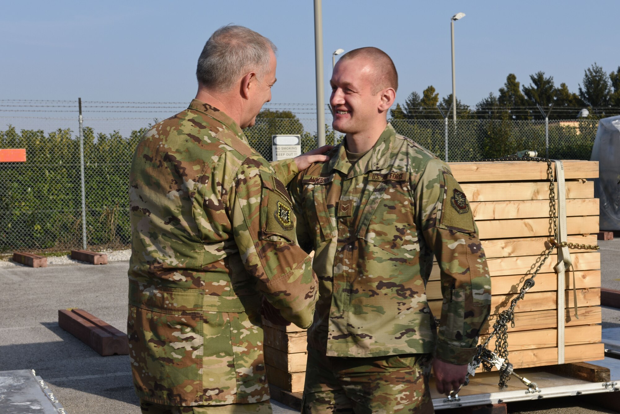 U.S. Air Force Maj. Gen. John Gordy, U.S. Air Force Expeditionary Center commander, recognizes U.S. Air Force Staff Sgt. Chase Anderson, 724th Air Mobility Squadron aircraft services specialist, for his accomplishments and contributions to the mission at Aviano Air Base, Italy, Jan. 24, 2020. The 724th AMS consists of a combat readiness flight, passenger and aircraft services section, air mobility control center and an air terminal operation center.