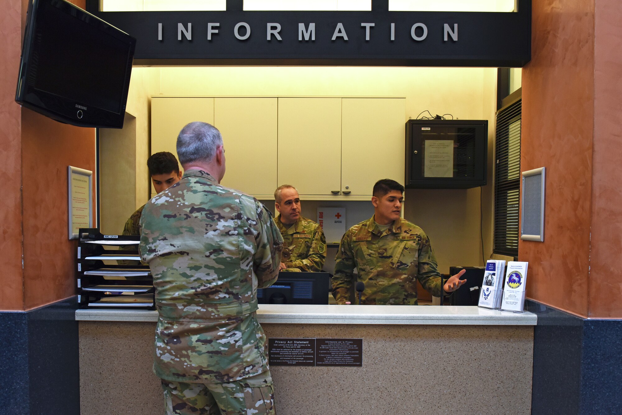 U.S. Air Force Maj. Gen. John Gordy, U.S. Air Force Expeditionary Center commander, and U.S. Air Force Chief Master Sgt. Kristopher Berg, USAF Expeditionary Center command chief, speak with Airmen from the 724th Air Mobility Squadron about their duties at Aviano Air Base, Italy, Jan. 24, 2020. The 724th AMS consists of a combat readiness flight, passenger and aircraft services section, air mobility control center and an air terminal operation center.