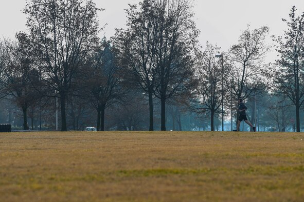 U.S. Air Force Airman 1st Class Dale Riehl, 31st Aircraft Maintenance Squadron, 56th Helicopter Maintenance Unit, helicopter tilt rotor maintainer, runs on the track at Aviano Air Base, Italy, Jan. 27, 2019. Health benefits from an active lifestyle will increase productivity, optimize health, and decrease absenteeism while maintaining a higher level of readiness. (U.S. Air Force photo by Airman 1st Class Ericka A. Woolever)