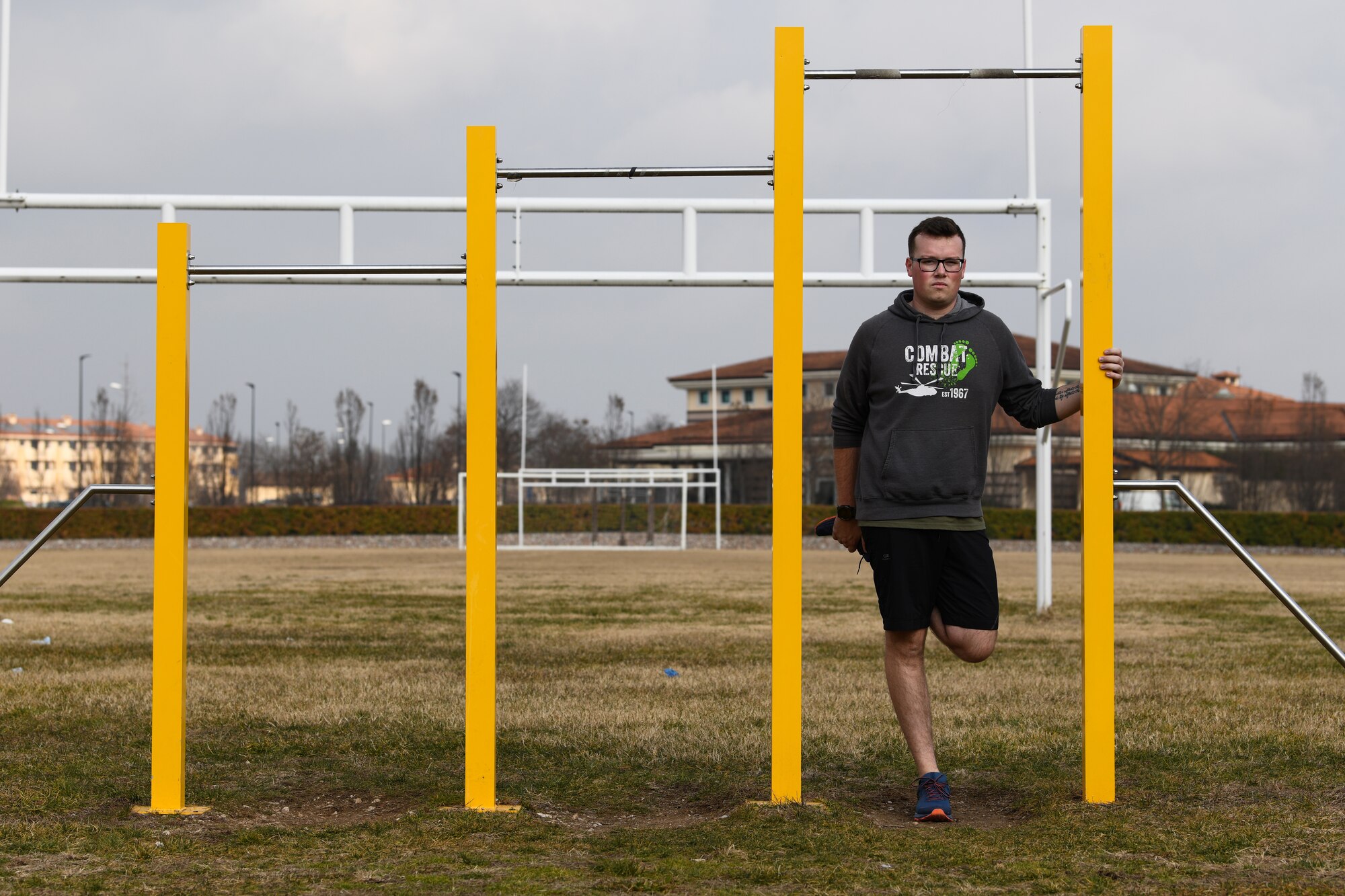 U.S. Air Force Airman 1st Class Dale Riehl, 31st Aircraft Maintenance Squadron, 56th Helicopter Maintenance Unit, helicopter tilt rotor maintainer, stretches his quadriceps after his workout at Aviano Air Base, Italy, Jan. 27, 2019. One of the main goals of the Air Force Fitness Program is to motivate Airmen to participate in a year-round physical conditioning program that emphasizes various components such as flexibility training. (U.S. Air Force photo by Airman 1st Class Ericka A. Woolever)