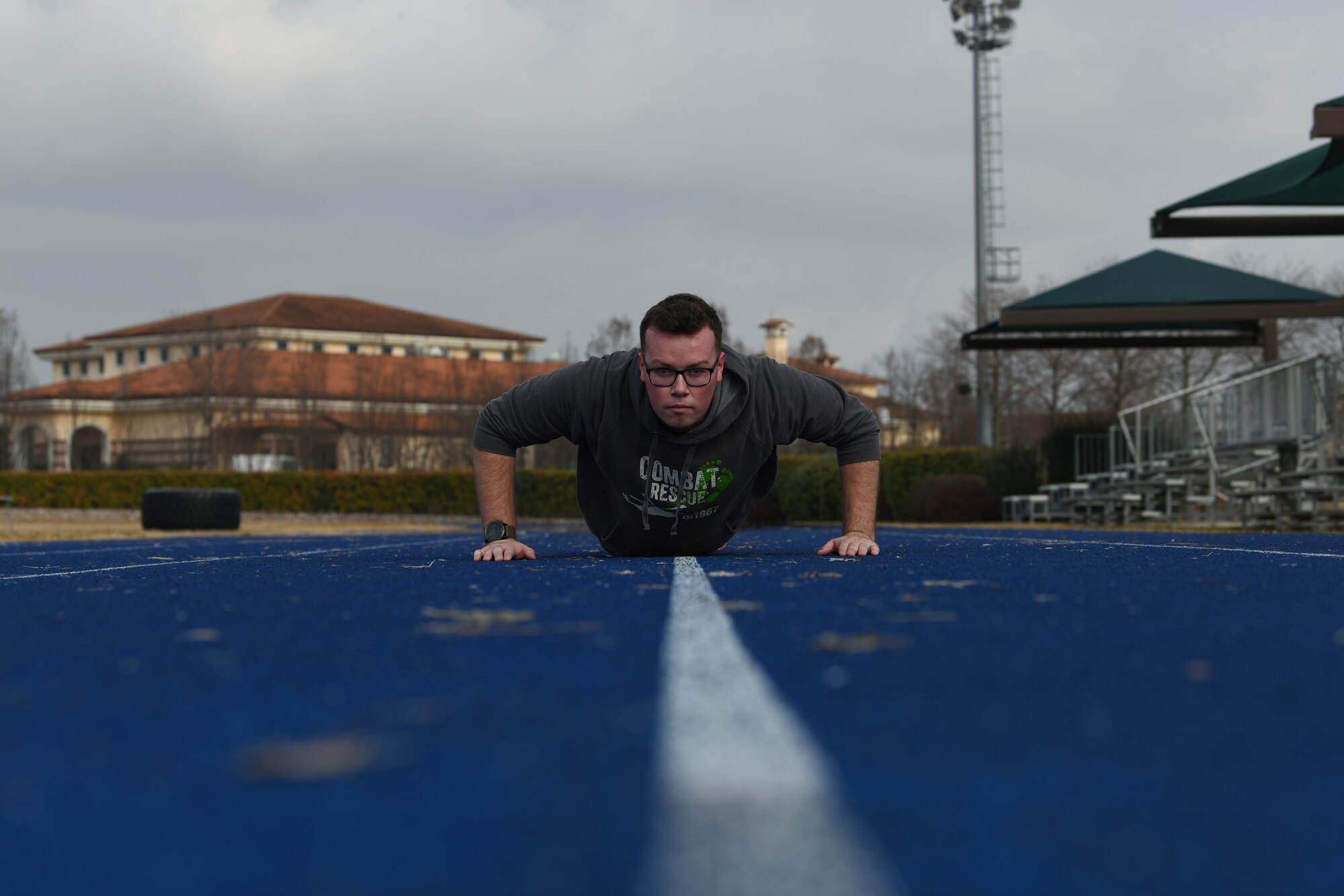 U.S. Air Force Airman 1st Class Dale Riehl, 31st Aircraft Maintenance Squadron, 56th Helicopter Maintenance Unit, helicopter tilt rotor maintainer, performs as many pushups as he can in one minute at Aviano Air Base, Italy, Jan. 27, 2019. Being physically fit allows Airmen to properly support the Air Force mission. (U.S. Air Force photo by Airman 1st Class Ericka A. Woolever)