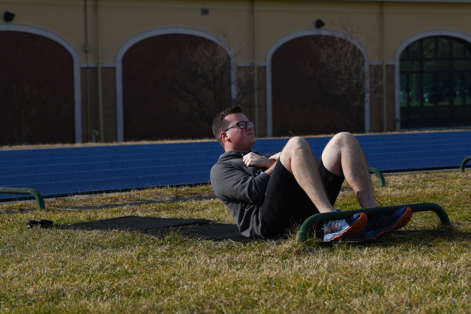 U.S. Air Force Airman 1st Class Dale Riehl, 31st Aircraft Maintenance Squadron, 56th Helicopter Maintenance Unit, helicopter tilt rotor maintainer, performs as many sit-ups as he can in 1 minute at Aviano Air Base, Italy, Jan. 27, 2019. Riehl administered a mock physical fitness assessment for himself. The Air Force Fitness Program’s goal is to motivate Airmen to participate in a year-round physical conditioning program that emphasizes total fitness including proper aerobic conditioning, strength and flexibility training, and healthy eating. (U.S. Air Force photo by Airman 1st Class Ericka A. Woolever)