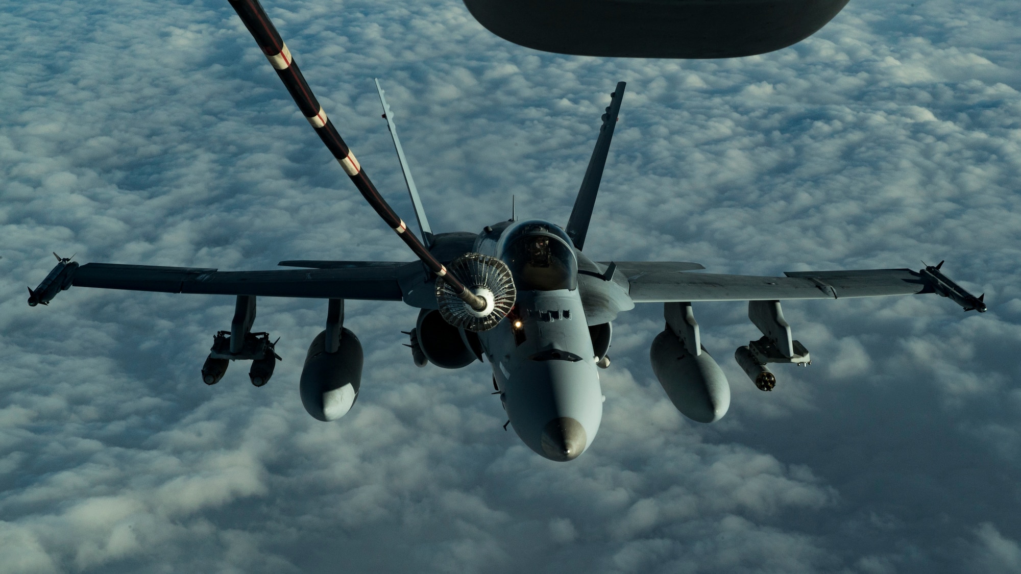 A U.S Marine Corps F/A-18 Hornet assigned to the Marine Fighter Attack Squadron (VMFA) 251 receives fuel from a KC-10 Extender assigned to the 908th Expeditionary Air Refueling Squadron over the U.S. Central Command area of responsibility, Jan. 22, 2020.