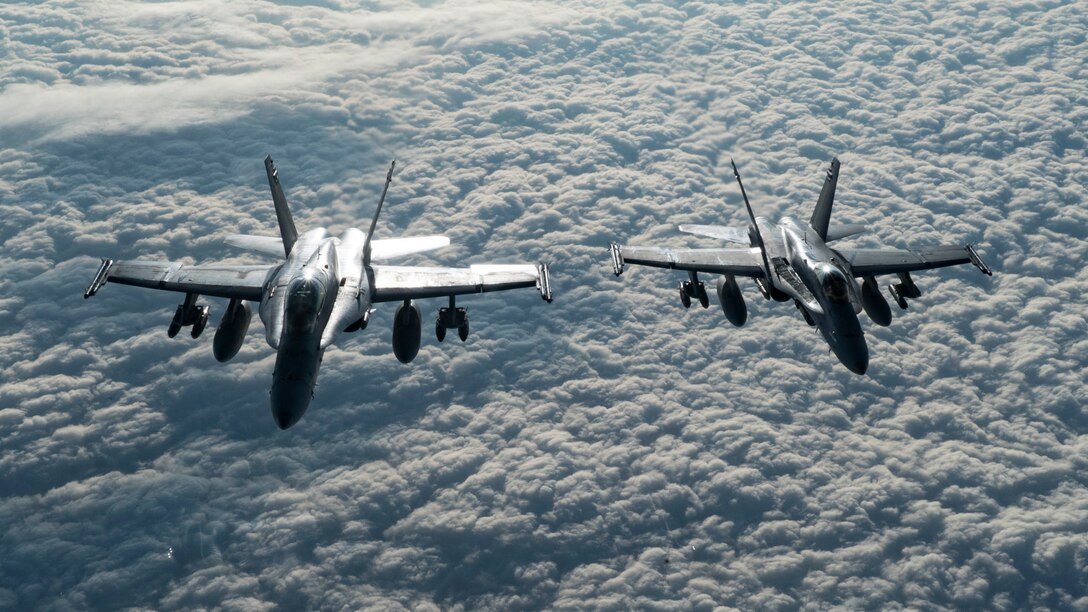 Two U.S Marine Corps F/A-18 Hornets assigned to the Marine Fighter Attack Squadron (VMFA) 251 fly over the U.S. Central Command area of responsibility, Jan. 22, 2020.