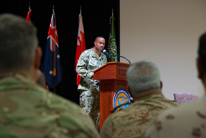 Rear Adm. Alvin Holsey, commander of the International Maritime Security Construct (IMSC), delivers remarks during a change of command ceremony for the IMSC. Holsey was relieved by Royal Navy Commodore James Parkin during the ceremony. IMSC maintains the freedom of navigation, international law, and free flow of commerce to support regional stability and security of the maritime commons.