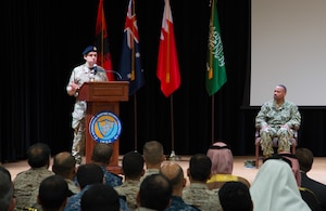 Royal Navy Commodore James Parkin delivers remarks after assuming command of the International Maritime Security Construct (IMSC) during a change of command ceremony. Parkin relieved Rear Adm. Alvin Holsey during the ceremony. IMSC maintains the freedom of navigation, international law, and free flow of commerce to support regional stability and security of the maritime commons.