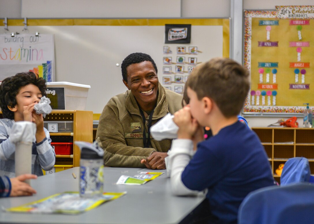U.S. Air Force Airman 1st Class Dante N. Summers, 606th Air Control Squadron power production technician, teaches students how to make a kazoo during a Science, Technology, Engineering and Math Junk Box Challenge at Aviano Elementary School, Aviano Air Base, Italy, Jan. 28, 2020. Summers volunteered for the STEM event because he was a middle school teacher’s aide before he joined the military. (U.S. Air Force photo by Airman Thomas S. Keisler IV)