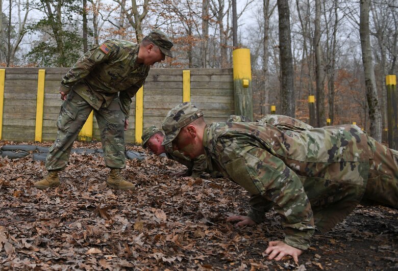 A U.S. Army Soldier motivates initial entry training Soldiers during a field training exercise at Joint Base Langley-Eustis, Virginia, Jan. 24, 2020.