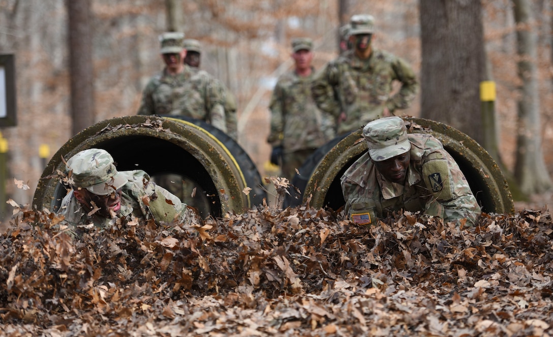 U.S. Army Advanced Individual Training Soldiers crawl through cement pipes during a field training exercise at Joint Base Langley-Eustis, Virginia, Jan. 24, 2020.