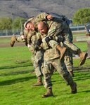 Cal Guard Master Fitness Trainer (MFT) students from around California conduct Physical Readiness Training (PRT) as part of the two-week MFT course, Camp San Luis Obispo, December 2019. The PRT's three-part guerrilla drill includes the lunge walk, shoulder roll and Soldier carry.