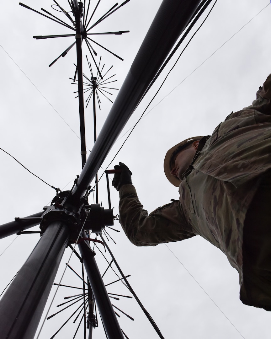 Tech. Sgt. Keith Schalk, Arkansas Air National Guard, raises the top of the antenna that utilizes satellite systems to increase communications during responses to natural disasters in the state.