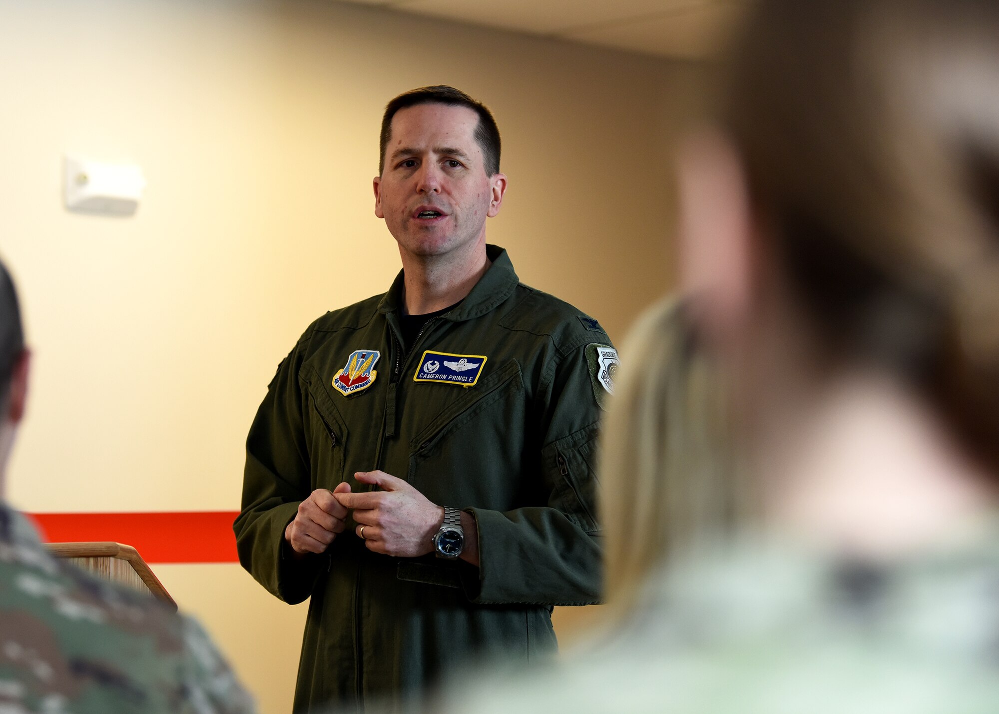Col. Cameron Pringle, 319th Reconnaissance Wing commander, center, and Col. Chad Atkinson-Adams, 319th Security Forces Squadron commander, cut a ribbon during the grand-opening of a new K-9 facility at Grand Forks Air Force Base, N.D., Jan. 24, 2020. The six-year project cost an estimated $2.1 million. (U.S. Air Force photo by Staff Sgt. Patrick A. Wyatt)