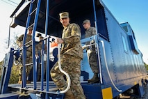 Brig. Gen. Richard W. Gibbs, Air Mobility Command Logistics, Engineering and Force Protection director, steps onto a train at Joint Base Charleston, S.C., Jan. 28, 2020.