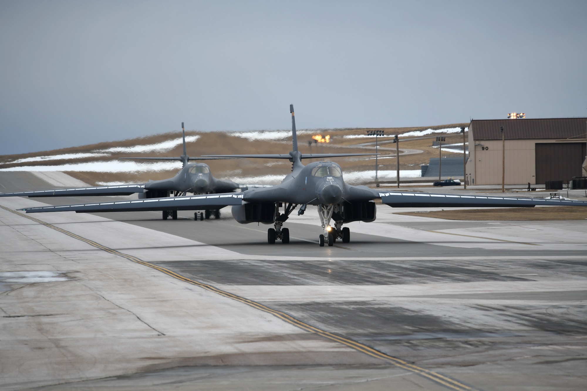 B-1B Lancers assigned to the 28th Bomb Wing at Ellsworth Air Force Base, S.D., leave the parking apron of the flight line, Jan. 22, 2020. Aircrews and B-1s from the 37th Bomb Squadron launched for Red Flag 20-1, a two-week advanced aerial combat training exercise held several times a year by the U.S. Air Force. (U.S. Air Force photo by Staff Sgt. Hailey Staker)