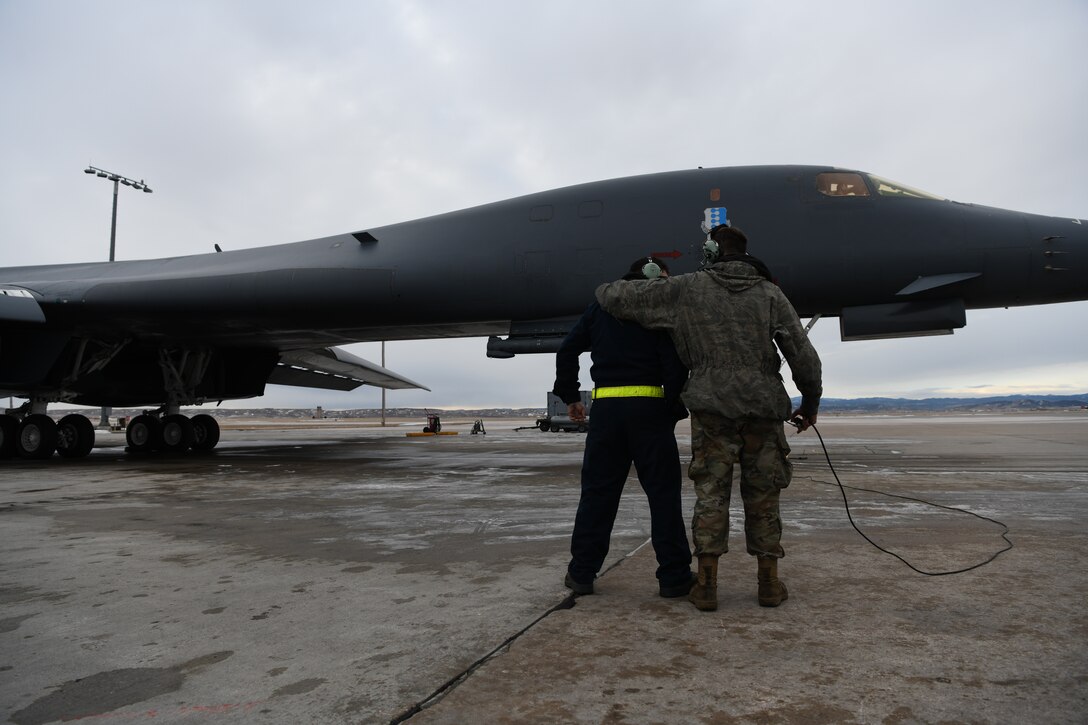 Two 37th Bomb Squadron crew chiefs work together to prepare a B-1B Lancer for Red Flag 20-1 at Ellsworth Air Force Base, S.D., Jan. 22, 2020. Each year, four to six Red Flag exercises are held at Nellis Air Force Base, Nev. (U.S. Air Force photo by Senior Airman Nicolas Z. Erwin)