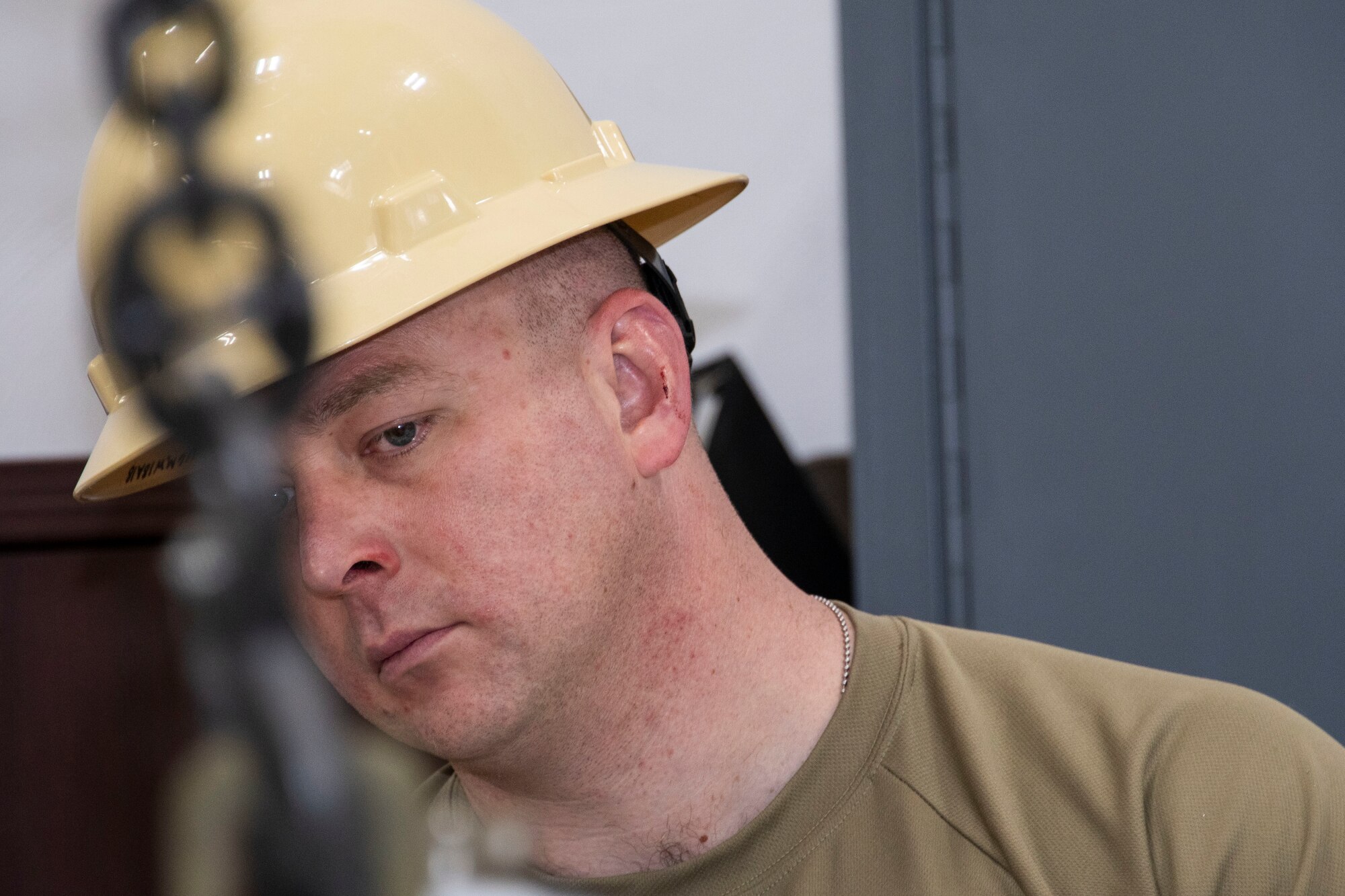 Photo of Airman watching munition