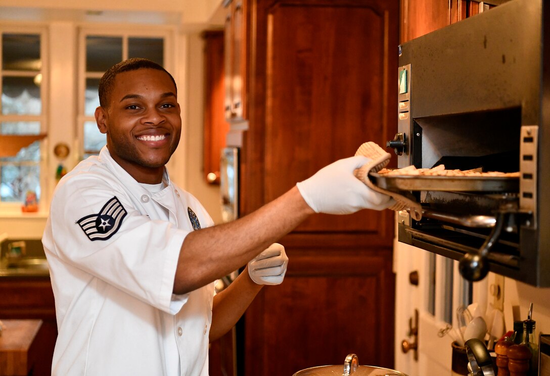 SSgt Martavious Miller assists as aide of the deputy commander during a Christmas party hosted by the commander and his family at Wright-Patterson Air Force Base, November 11 2019. (photo by Scott Ash)