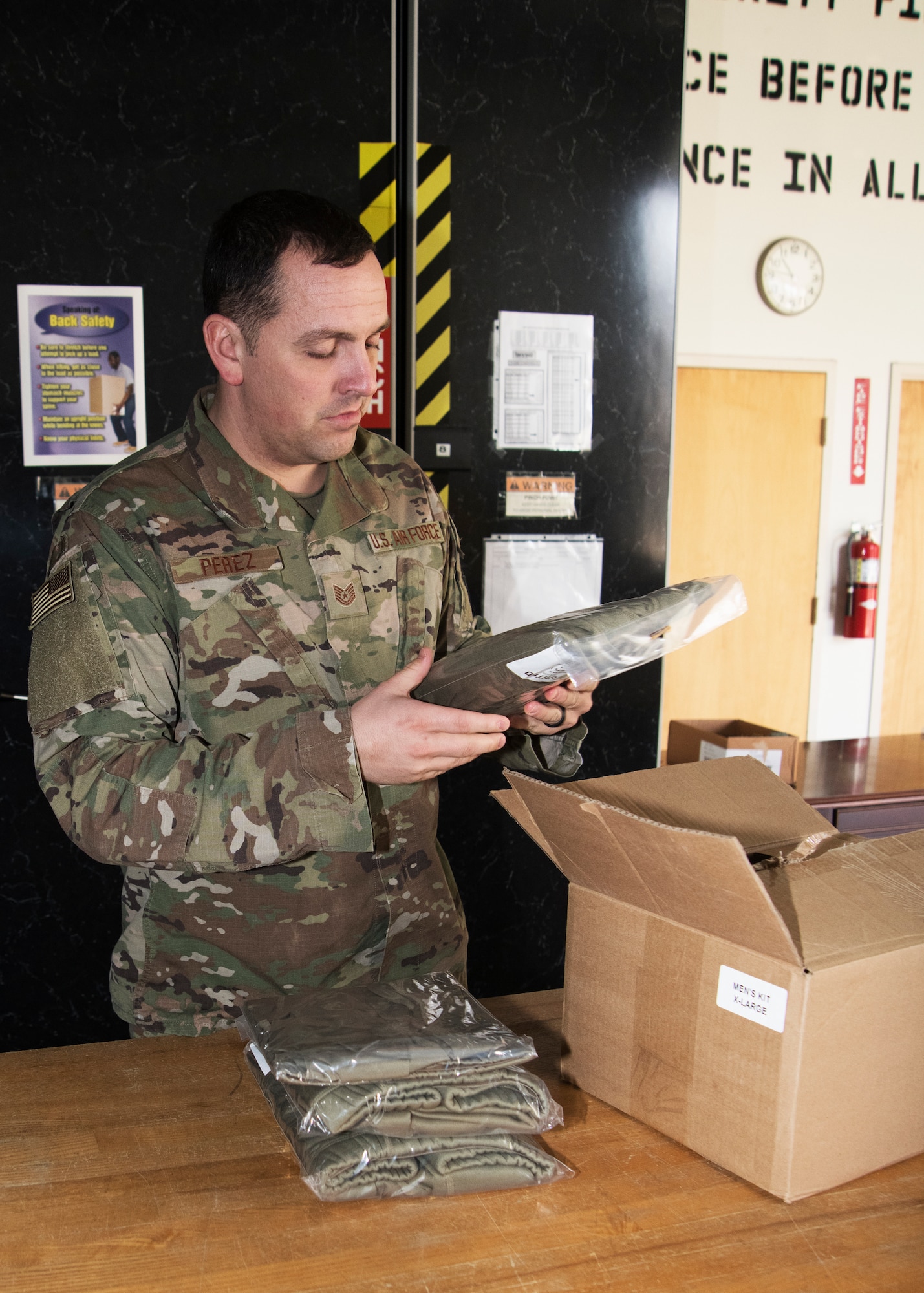 Tech Sgt. Michael Perez, 459th Security Forces Squadron, assistant Non-Commissioned Officer in Charge of Training and Readiness, sorts through a box of uniforms Jan. 30, 2020, at Joint Base Andrews, Md. Perez recently won the Outstanding Security Forces Support Staff Non-Commissioned Officer award at the Air Force Reserve Command level. (U.S. Air Force photo/SSgt. Cierra Presentado)