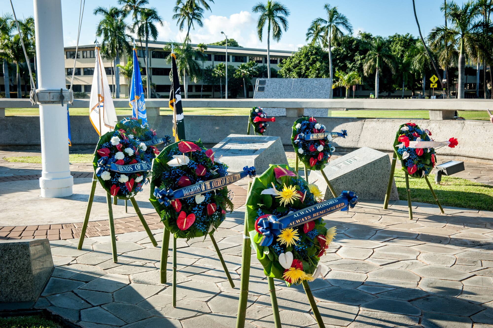 Wreath on behalf of the men and women of Pacific Air Forces at the flag pole during the Hickam Field Dec. 7th Remembrance Ceremony at Atterbury Circle, Joint Base Pearl Harbor-Hickam, Hawaii, Dec. 7, 2019.
