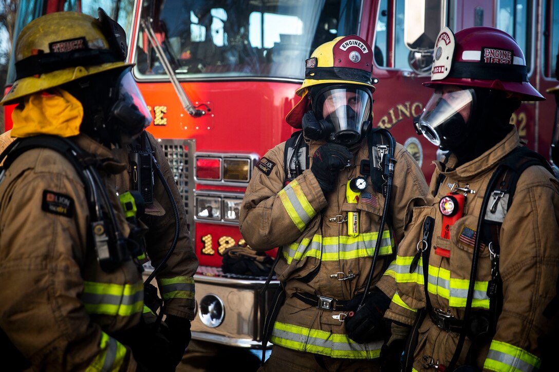 Firefighters from various agencies wait to enter a burning structure during a joint structural firefighting exercise at Marine Corps Base Camp Pendleton, California, Jan. 28, 2020. The Camp Pendleton Fire Department regularly hosts a variety of training exercises to strengthen their partnerships and cohesion with fire departments from surrounding communities in preparation for the annual wildfire season. (U.S. Marine Corps photo by Cpl. Dylan Chagnon)
