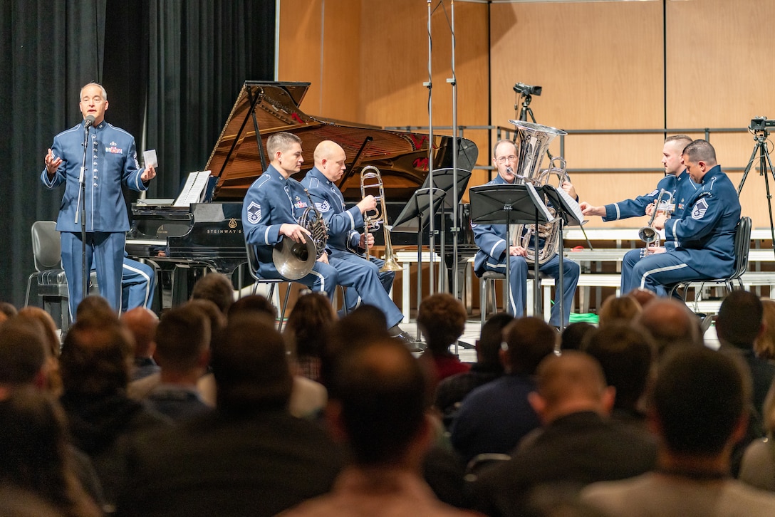 Senior Master Sgt. Phil Krzywicki speaks to the audience before members from The U.S. Air Force Concert Band perform during a chamber music concert at The Midwest Clinic in Chicago, Illinois, on Dec. 18, 2019. The Midwest Clinic International Band, Orchestra and Music Conference brings together musicians, educators and people passionate about music education of all skill levels in Chicago each year for the largest music conference of its kind. (U.S. Air Force Photo by Master Sgt. Josh Kowalsky)