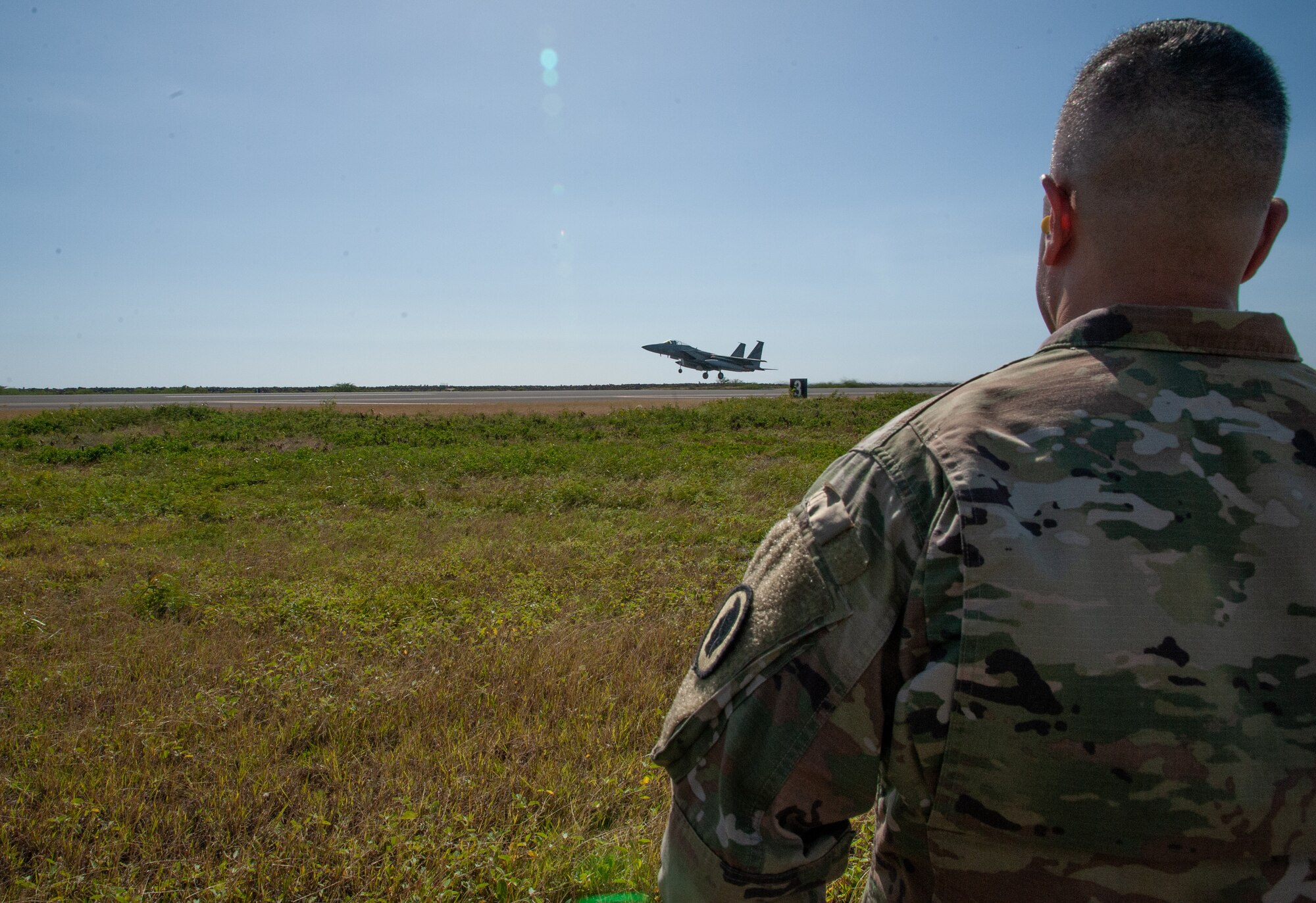 The Adjutant General of Hawaii, Maj. Gen. Kenneth S. Hara, watches as a Hawaii F-22 Raptor takes off on the Joint Base Pearl Harbor-Hickam runway, January 21, 2020.