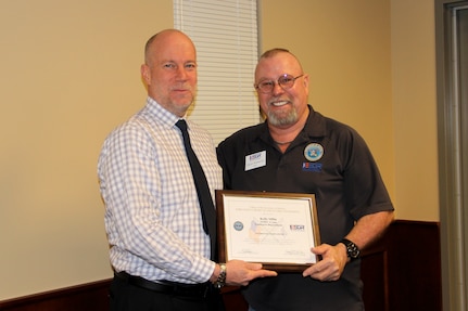 Kelly Siffin, Chief of Contracting at NSWC Crane, received the Employer Support of the Guard and Reserves (ESGR) Patriot Award, which acknowledges efforts to provide flexible schedules, time off prior to and after deployment, caring for families, and granting leaves of absences if needed.