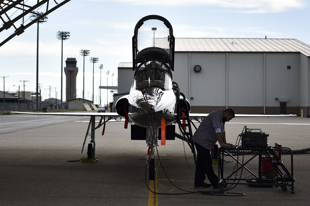 T-38 Talon mechanic works on aircraft