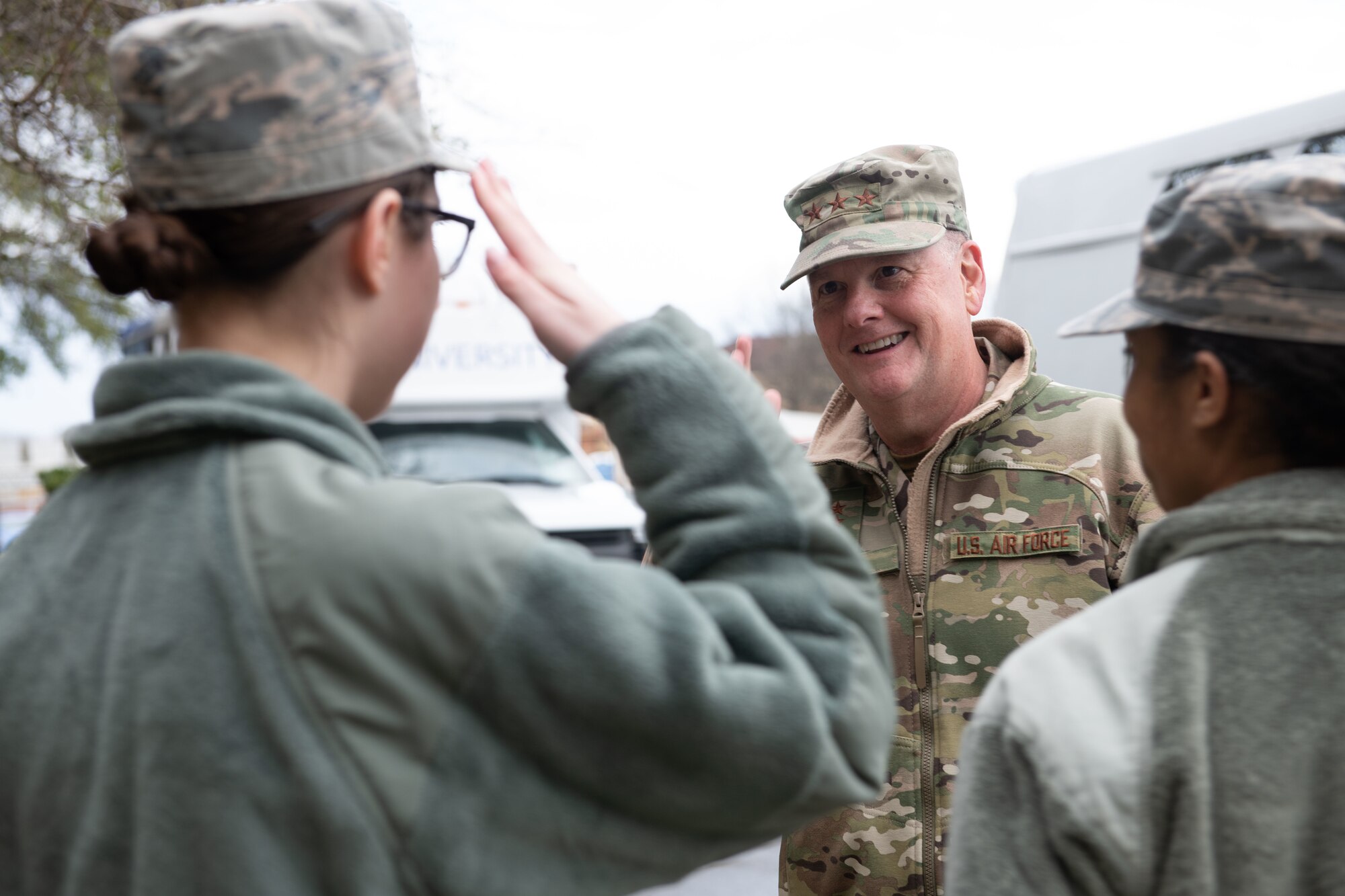 Lt. Gen. Marshall B. Webb, commander of Air Education and Training Command, returns a salute from a junior enlisted Airman while visiting the base dorms, Jan. 29, 2020, on Maxwell Air Force Base, Alabama. Webb, along with the leadership from Air University and the 42nd Air Base Wing toured the base dorms, including the rooms of Airmen in training and permanently stationed here, in order to understand and address housing concerns. (U.S. Air Force photo by Senior Airman Alexa Culbert)