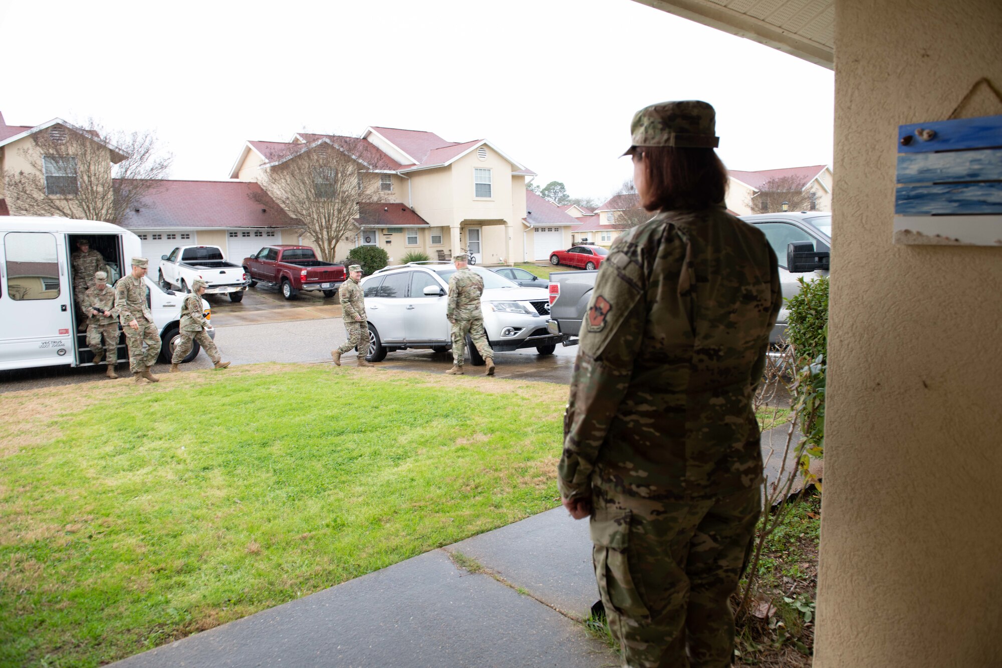 Master Sgt. Erica Brown, from the 42nd Medical Support Squadron, waits as her husband, Master Sgt. Brian Brown, from the 26th Network Operation Squadron, greets Lt. Gen. Marshall B. Webb, commander of Air Education and Training Command, upon arriving to their home Jan. 29, 2020, on Maxwell Air Force Base, Alabama. The AETC command team toured the Brown’s house in privatized housing, along with other houses and the dormitories, to speak with residents and understand the issues affecting Airmen’s quality of life. (U.S. Air Force photo by Senior Airman Alexa Culbert)