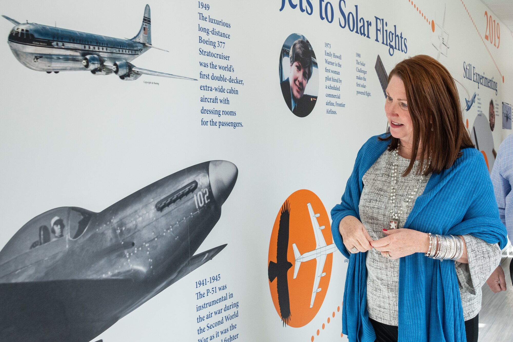 Dawna Webb, spouse of Lt. Gen. Brad Webb, commander of Air Education and Training Command, takes a closer look at a mural depicting the timeline of airpower while touring the new Maxwell Elementary Middle School Jan. 29, 2020 on Maxwell Air Force Base, Alabama. Webb was also accompanied by the spouses of Air University and 42nd Air Base Wing senior leaders. The group viewed the school’s recent renovations and progress made to improve public education options for military-connected children. (US Air Force photo by Melanie Rodgers Cox)